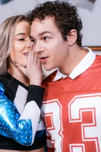 Whispering into Jayden's ears