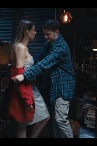 Sam pulling down her top